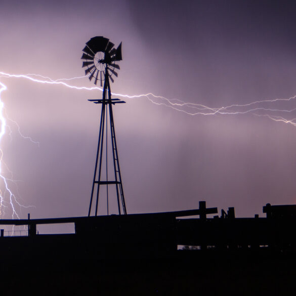 Lightning strikes behind a windmill in Western Oklahoma